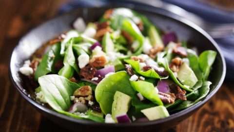 bowl of fresh avocado spinach salad