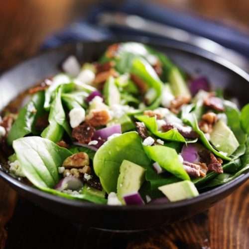 bowl of fresh avocado spinach salad