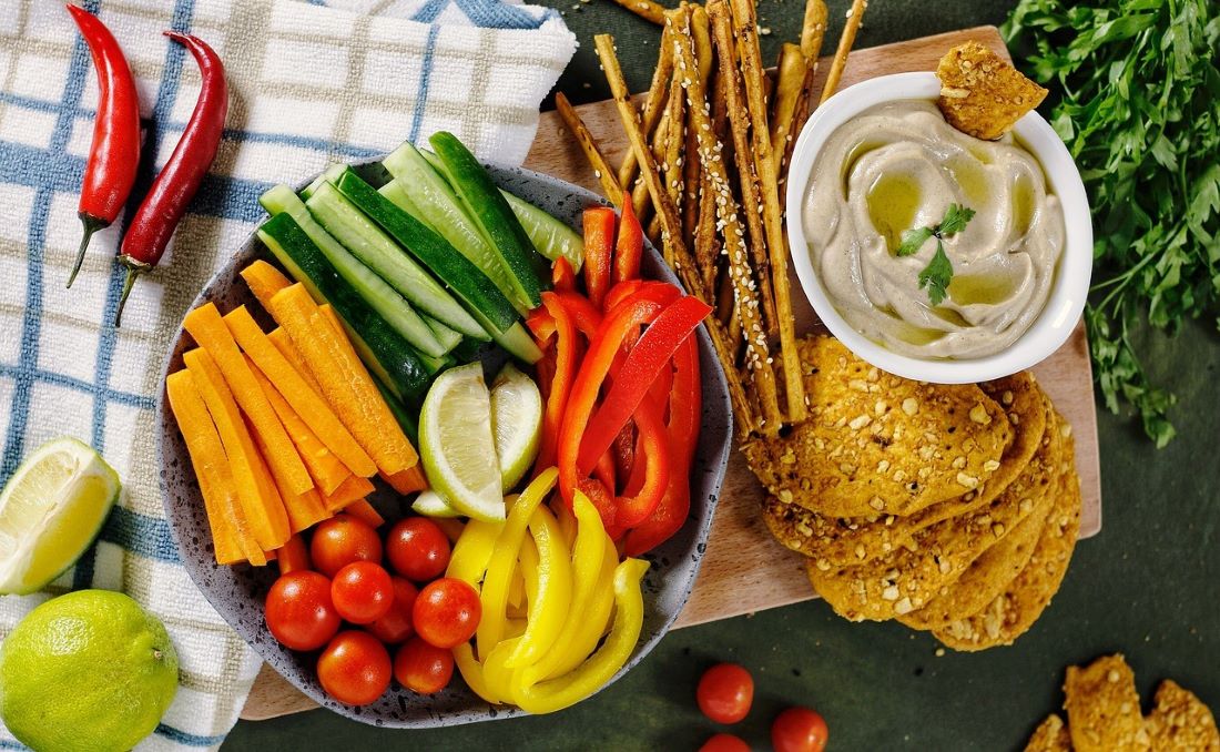 Veggies with assorted crackers and a dip.