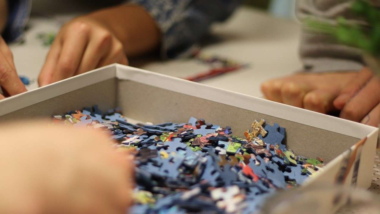 Children putting together a puzzle