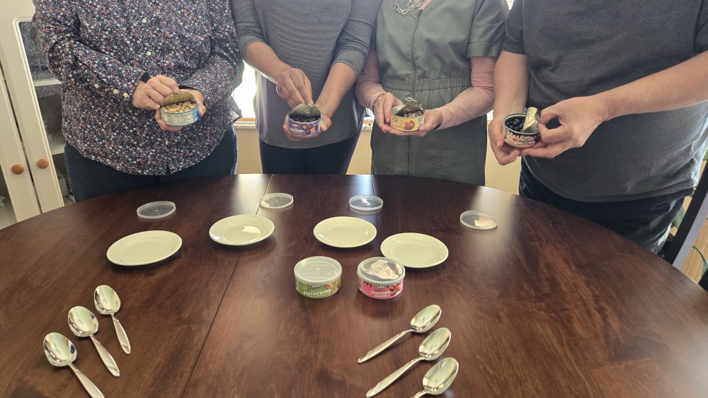 Focus group opening fresh cans of Chillo Foods snacks.