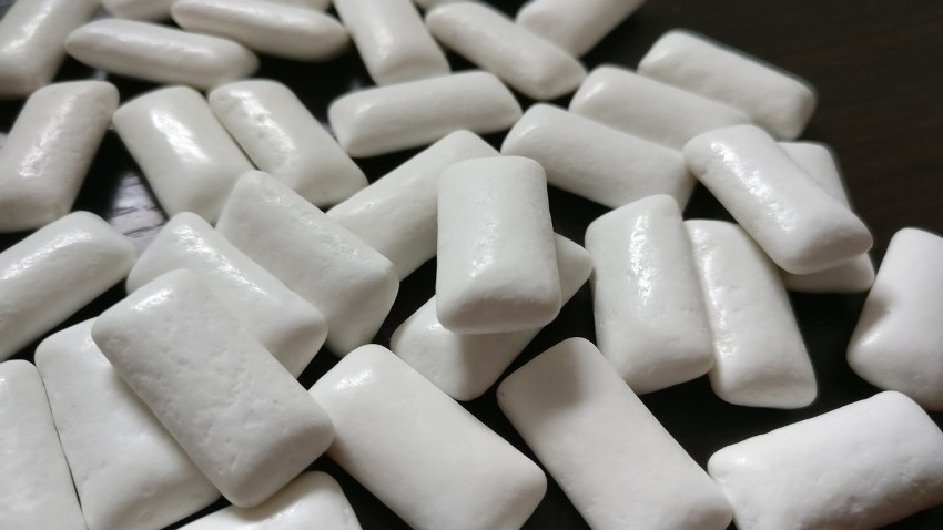 Closeup of sugar free gum pieces on a table.