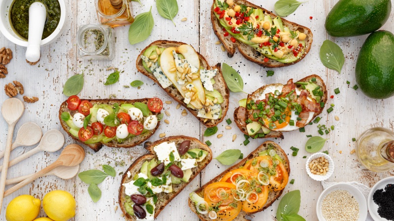 Avocado toast with assorted toppings. 