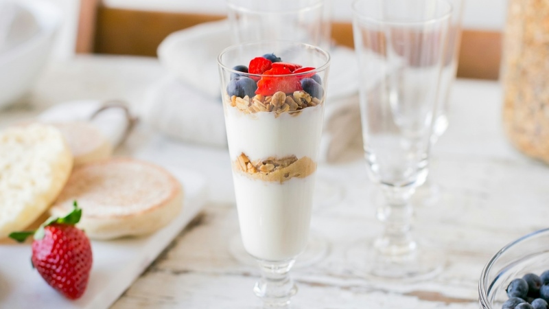 Yogurt parfait with seeds, granola and strawberries. 