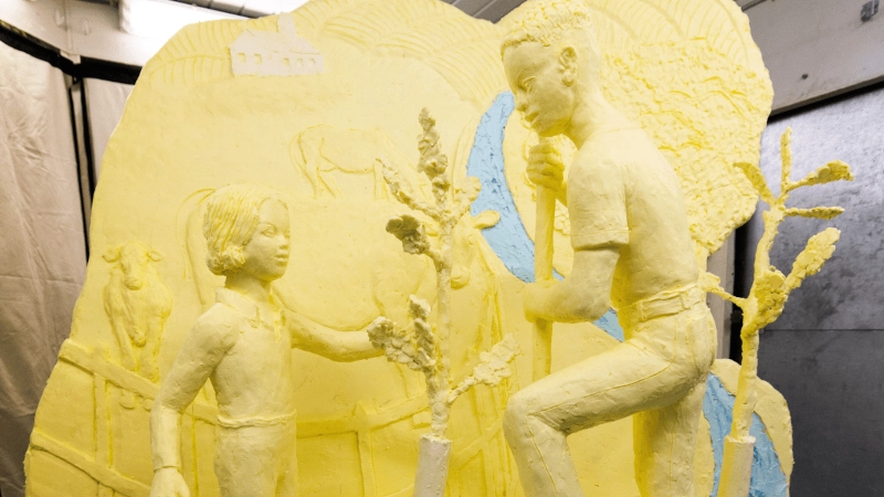 Butter sculpture of two kids.