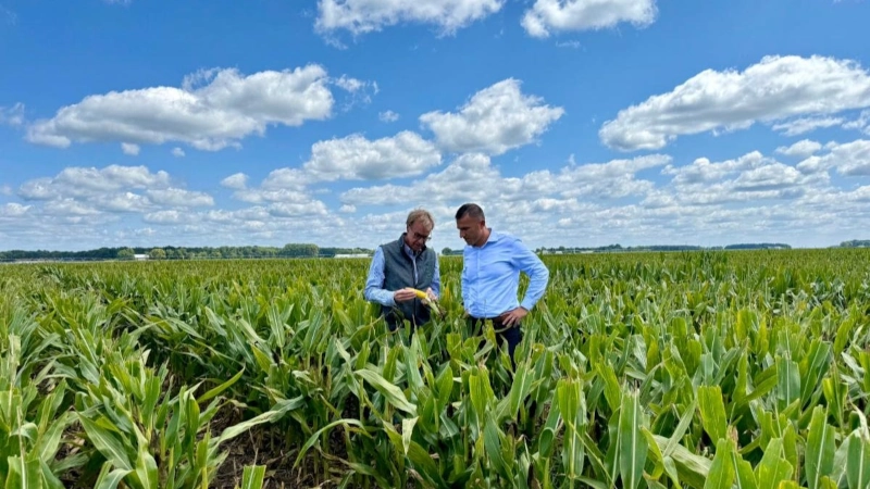 Indiana Rep. Rudy Yakym touring a corn field.