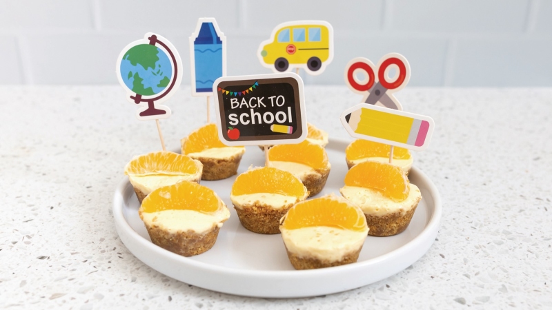 Mandarin Orange No-Bake Tarts on a plate with a "Back To School' sign.