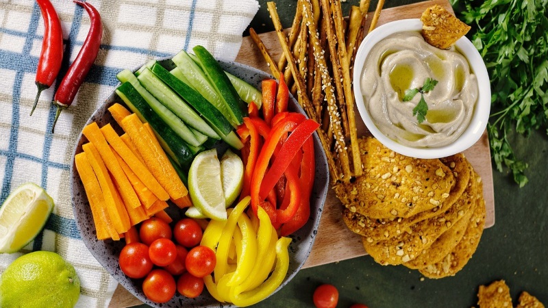 Assorted whole foods and hummus. 