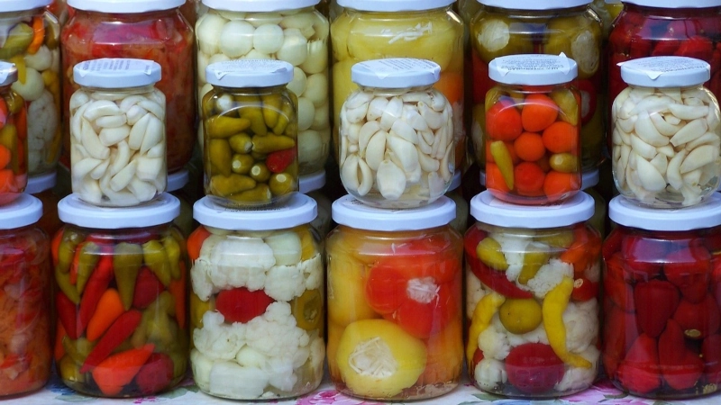 Jars of assorted pickled vegetables.