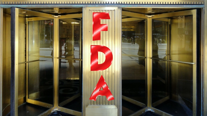 Revolving door with letters indicating FDA office.