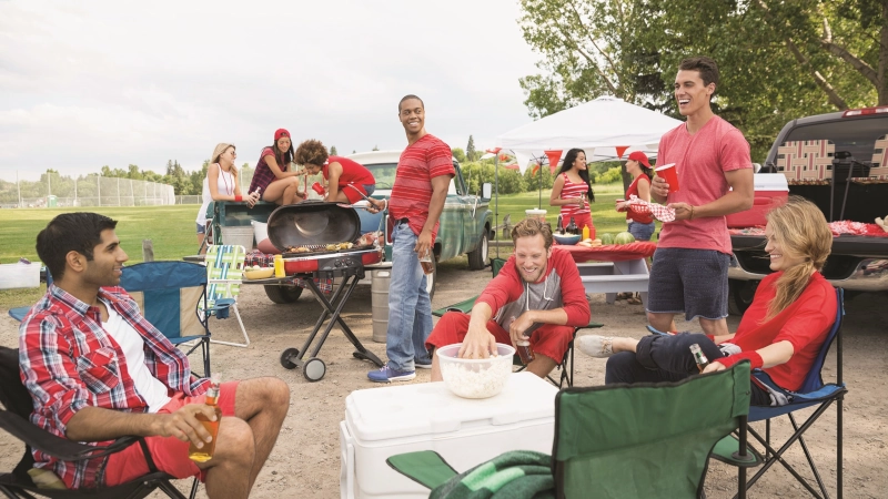 People enjoying a tailgate party.