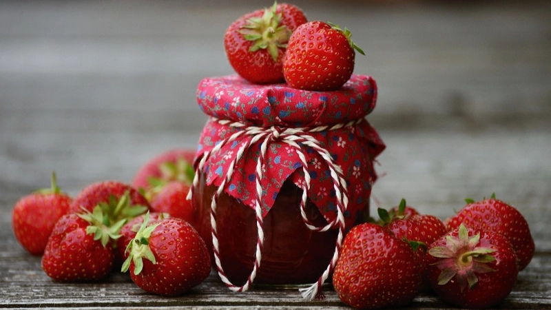 Jar of strawberry jam. 