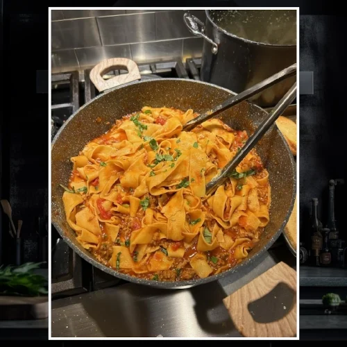 Pappardelle with Sausage and Carmelized Onion Ragu simmering in the pan.