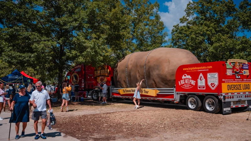 Massive Potato on a flatbed truck.