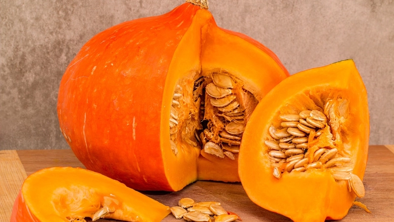 Pumpkin sliced on table.