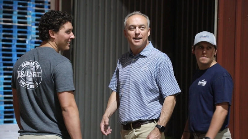 John Shuman and sons looking in the onion warehouse.