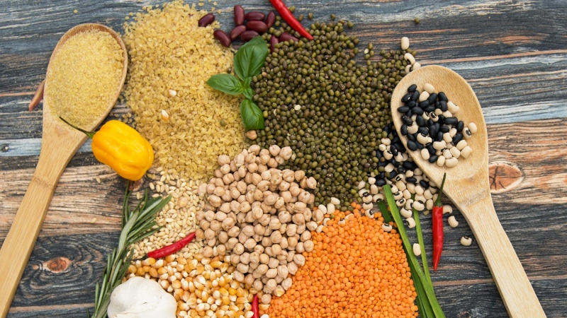 Overhead view of assorted pulses on a table.