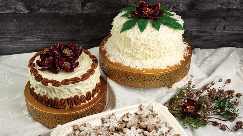 Holiday cakes and cookies on a table.