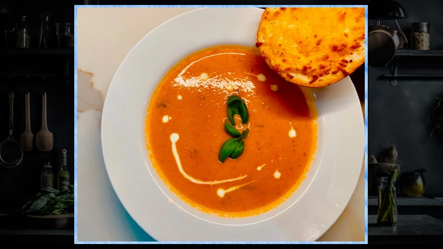 Bowl of Deepa's delicious tomato soup with garlic bread.