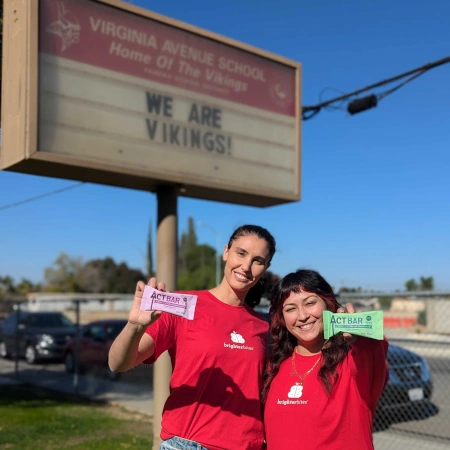 Volunteers holding Act Bars