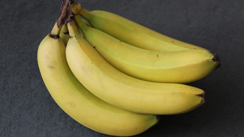 Bunch of bananas on a table.