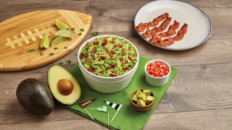 Championship Guacamole in a football themed place setting.