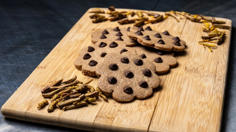 Upcycled chocolate chip cookies on a cutting board.