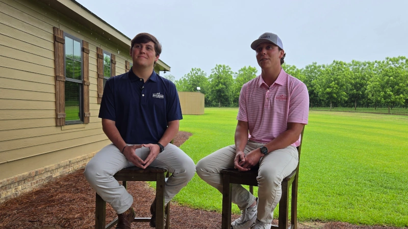 Luke & Jake Shuman sitting on back porch.