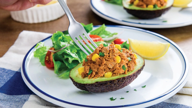 Plated tuna stuffed avocado