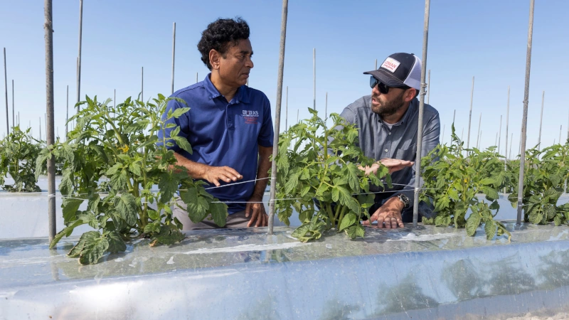 Sanjay Shukla with Lucas Conran at the farm.