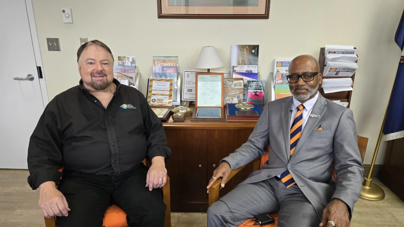 Chip Carter & Dr. Robert Corley, III sitting in office