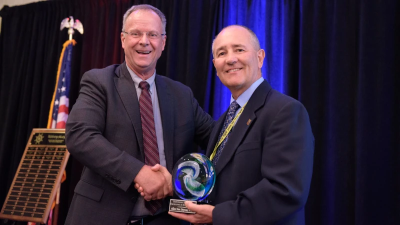 Dr. Allan Van Deynze accepting an award.