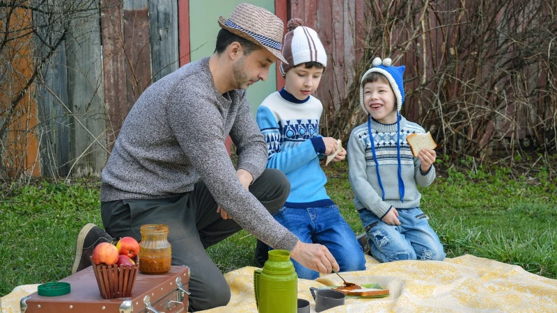 Father and kids having a picnic
