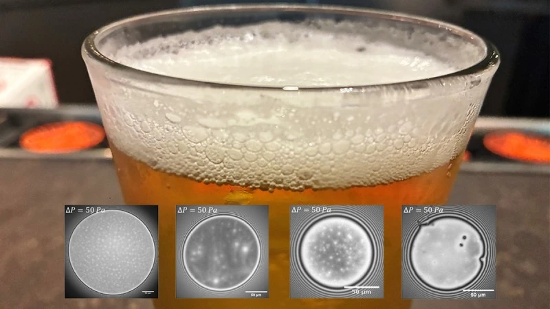 Glass of foamy beer with interferometry images of beer bubbles. 