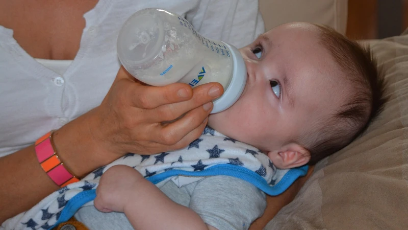 Baby being bottle fed. 