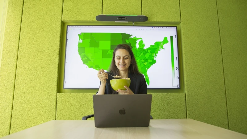 Woman eating a bowl of cereal.