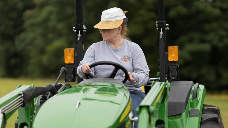Woman driving a tractor