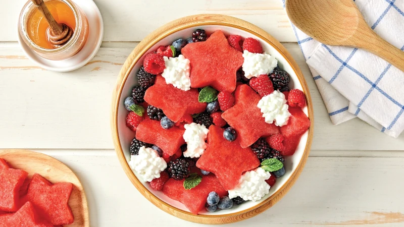 Bowl of watermelon berry fruit salad with cottage cheese.