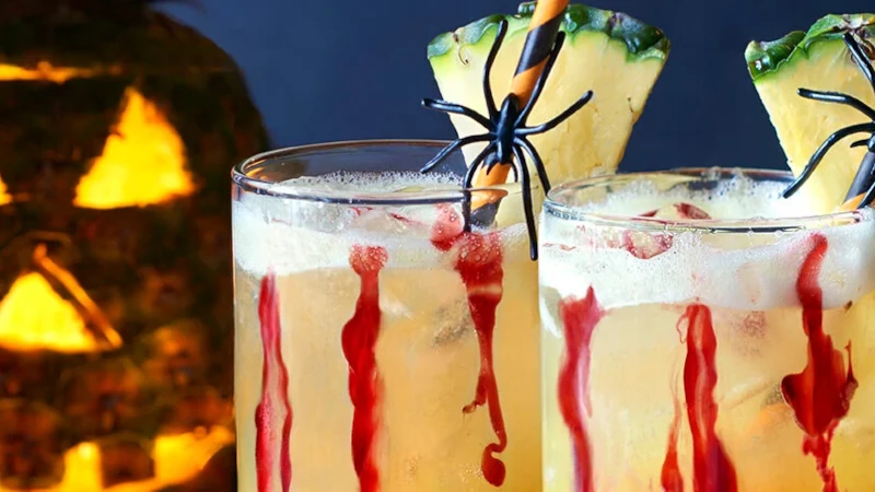 Glasses of sparkling juice with Halloween theme.