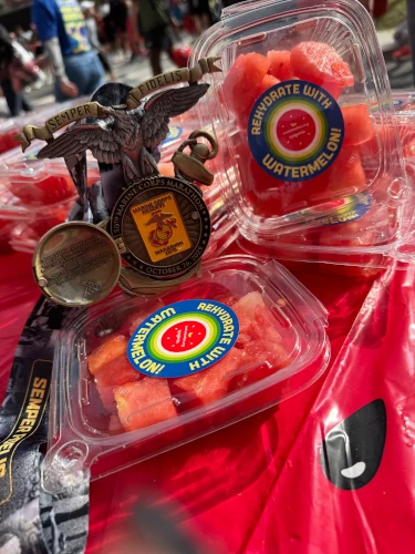 Race medal with packaged watermelon.