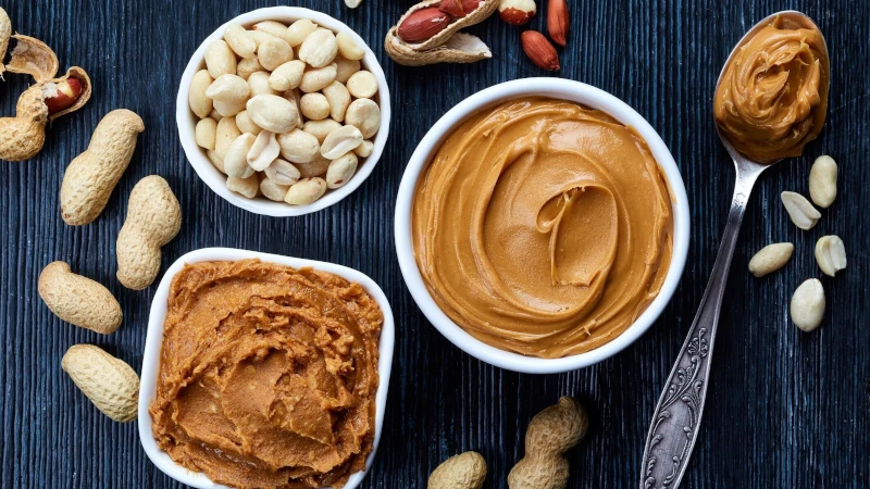 Table top shot of peanuts and peanut butter