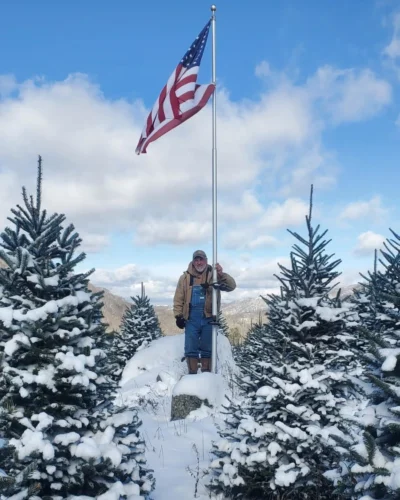 Lary Smith on a snowy mountain top.