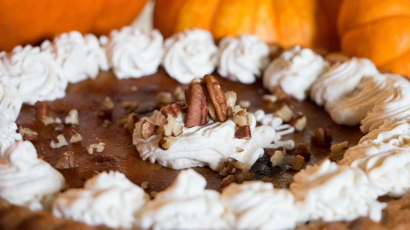 Chocolate pie with whipped cream and pecan topping.