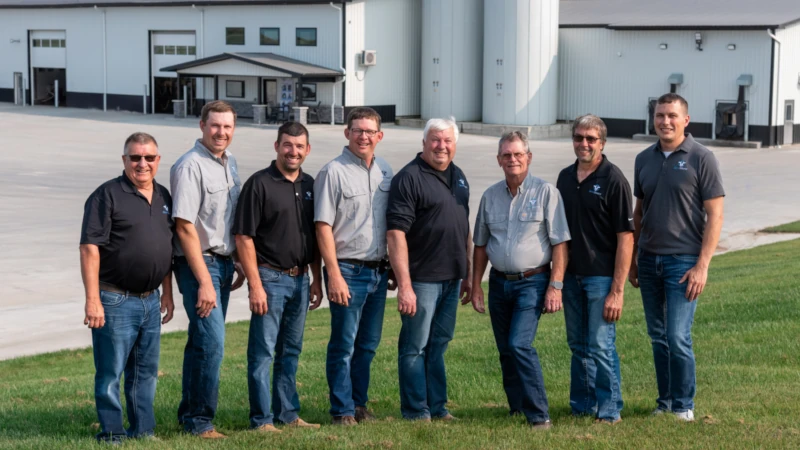 Men lined up for photo. 