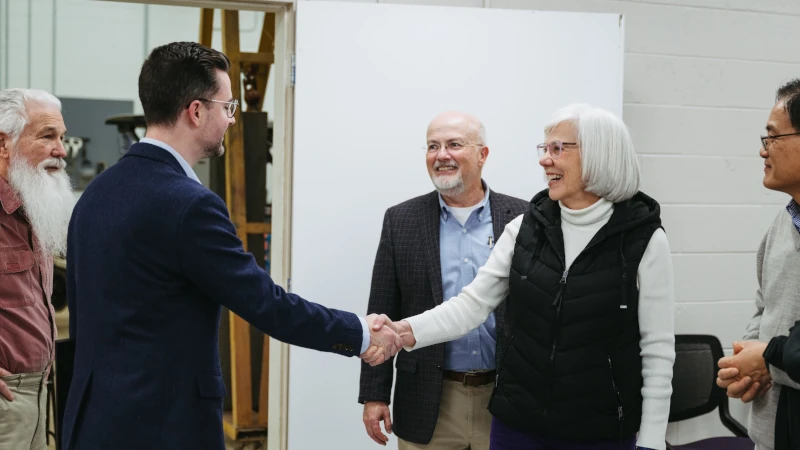 Man and woman shaking hands