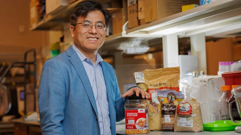 Man in lab with assorted foods.