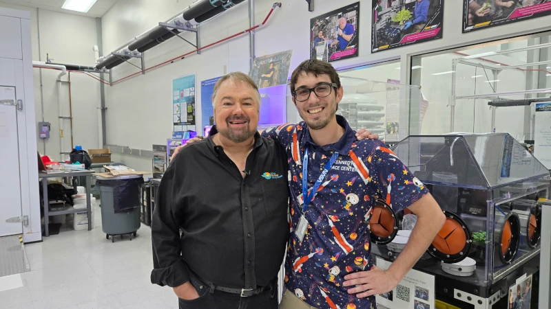Two men in a lab. 