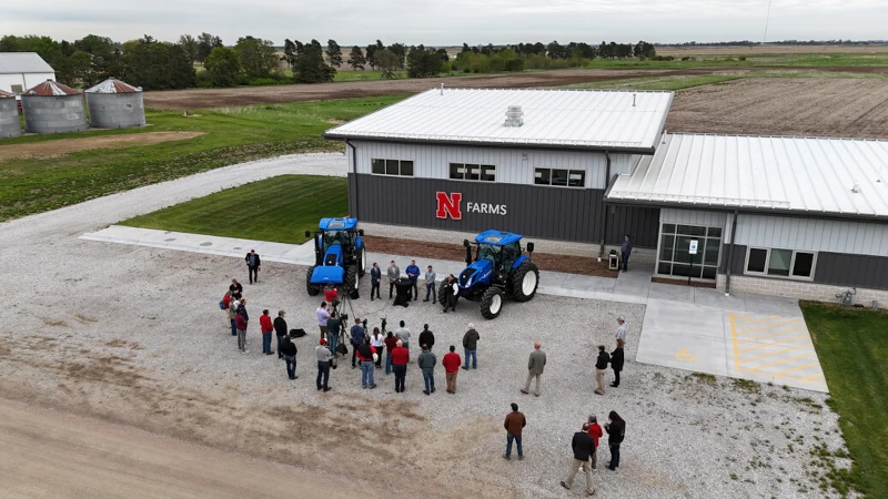 Crowd around two methane tractors.