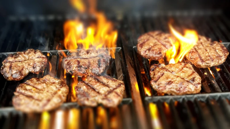 Burgers on flame grill