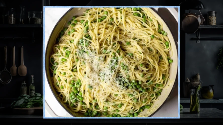 Bowl of spachetti with peas and parm.